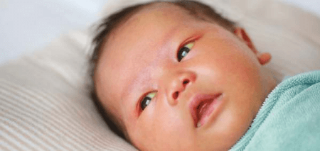 Pediatrician examining a baby during a medical check-up - Motherhood Hospitals India