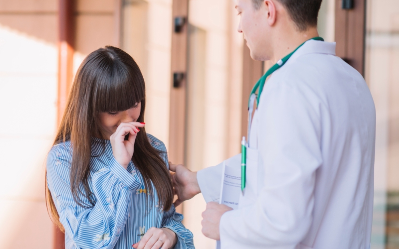 Doctor listening to a teen's concerns at motherhood hospital